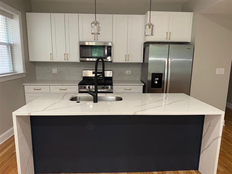 Kitchen island waterfall edge close-up completed by NG Construction & Improvements
