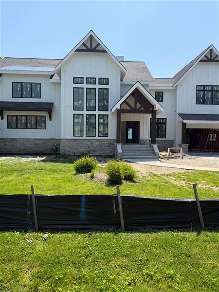 White modern farmhouse front exterior black Jeep completed by NG Construction & Improvements