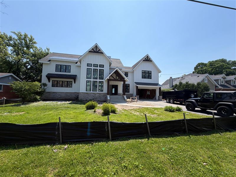 White modern farmhouse front view completed by NG Construction & Improvements