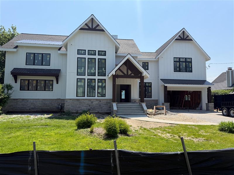White modern farmhouse front alternate view completed by NG Construction & Improvements